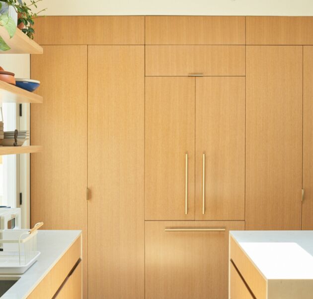 a kitchen remodel with white oak cabinets and frid