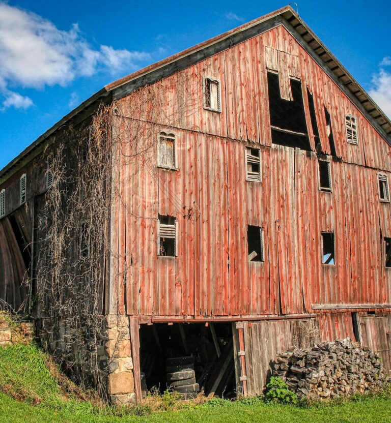 Large old barn with red weathered siding