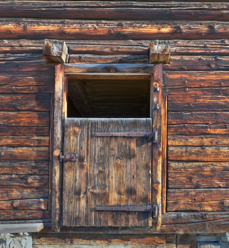 Old barn wall with a hay door