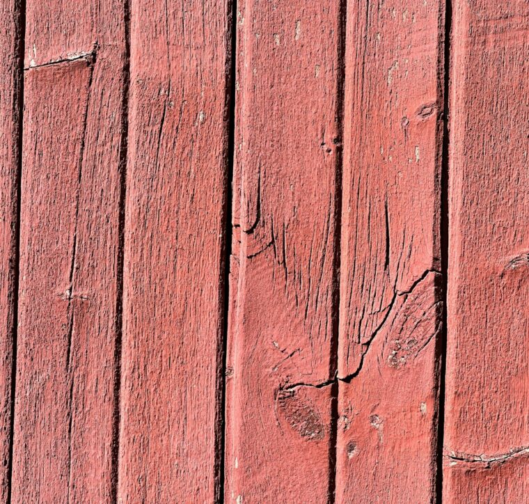 Weathered red-painted barn boards
