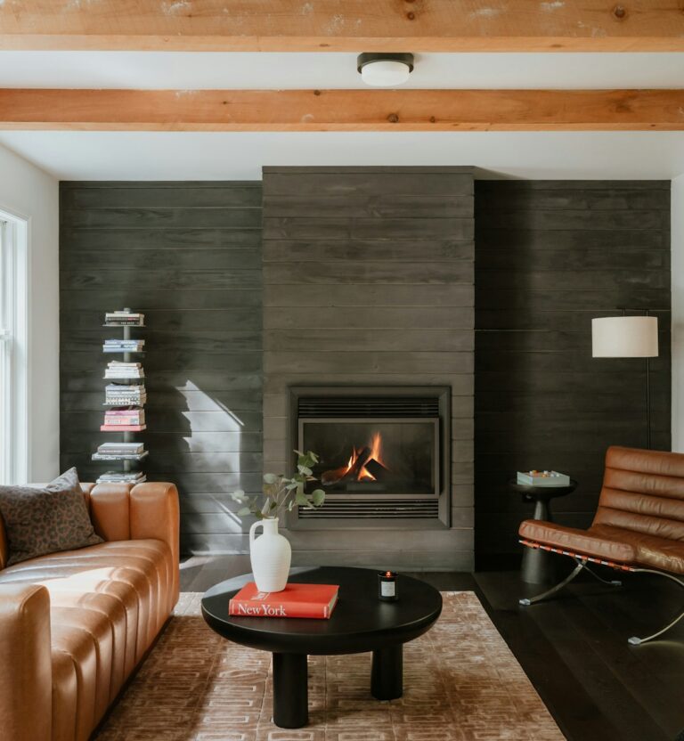 Living room with wood wall paneling and fireplace