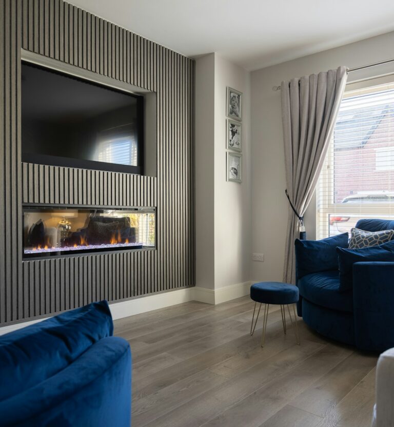 Wood slat paneling on a living room media wall